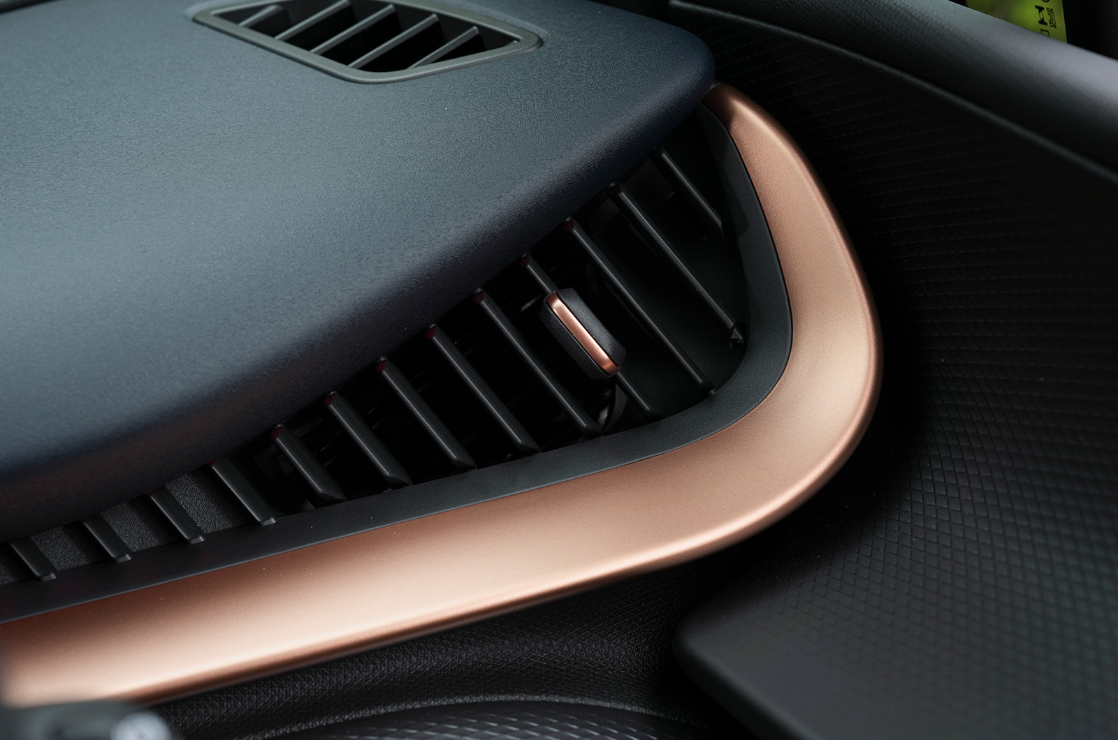 Close-up shot of bronze detailing on the dash of the CUPRA Tavascan