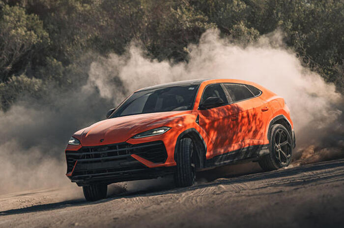 14 lamborghini urus se 2024 review front cornering off road