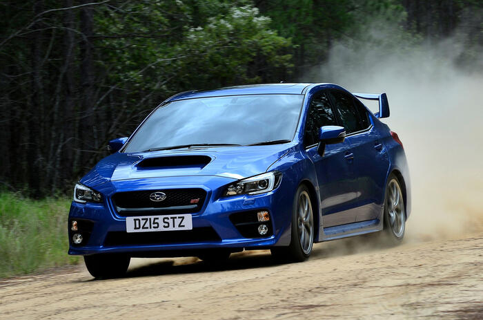 Subaru WRX STi on dirt front quarter tracking