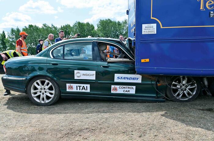 X type under lorry