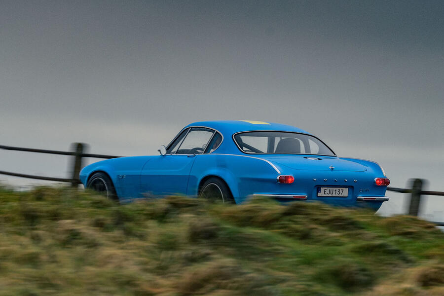 97 Cyan volvo p1800 feature drive hero rear