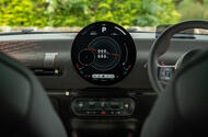 MINI Aceman JCW interior shot focusing on the circular OLED infotainment screen MINI Aceman JCW interior shot focusing on the circular OLED infotainment screen