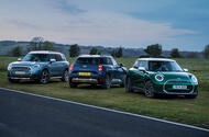 MINI electric range including Cooper, Aceman and Countryman All-electric MINI range, inluding the Cooper, Aceman and Countryman, pictured in front of a scenic countryside backfrop