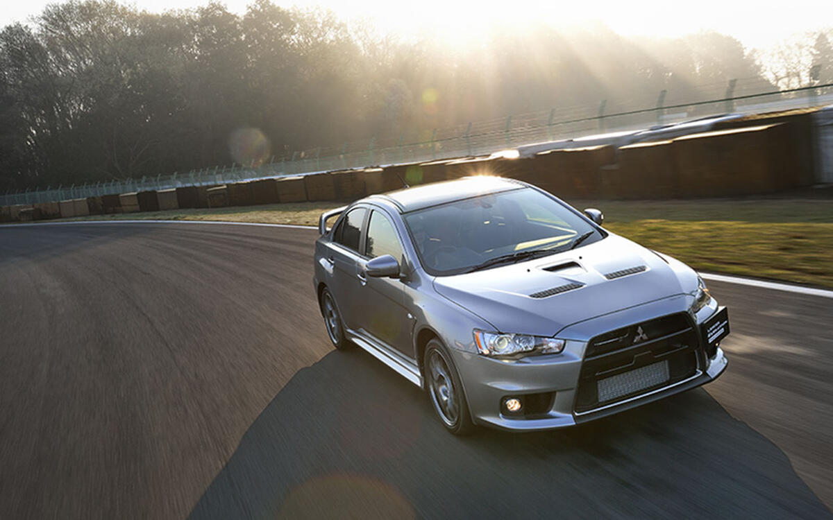 Mitsubishi Lancer Evolution vs. Subaru WRX STI Mitsubishi Lancer Evolution vs. Subaru WRX STI