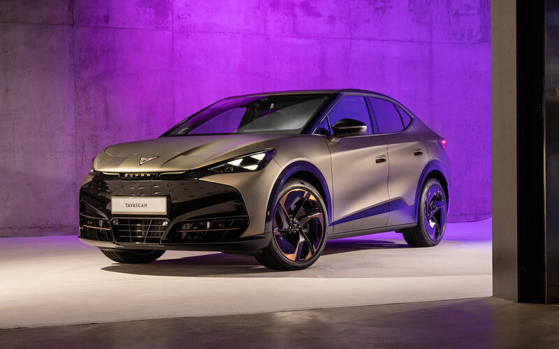 Front three-quarter exterior shot of a Century Bronze CUPRA Tavascan in a studio