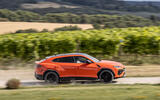 03 Lamborghini Urus SE 2024 review side driving 03 Lamborghini Urus SE 2024 review side driving