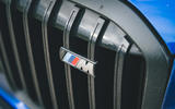 07 BMW X7 M60i RT 2023 M badge on black grille 07 BMW X7 M60i RT 2023 M badge on black grille