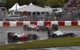Button triumphs in Canada classic
