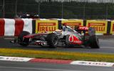 Button triumphs in Canada classic