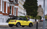2024 Mini Cooper C 3dr in yellow   cornering in town, rear