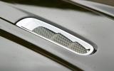 Deeply sculpted side skirts emphasise the width of the Virage, which is actually 25mm broader and has wider tracks, but is 7mm shorter than the DB9 Aston Martin Virage bonnet vents