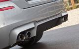 Valance diffuser panel smoothes underbody airflow BMW M5's quad exhaust system