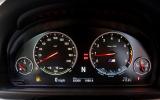 Instruments feature red needles with white illumination BMW M5 instrument cluster