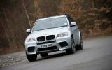 If you find yourself oversteering and staying on the power, xDrive will send power to the front wheels to help pull the car straight again and thus out of the tail slide.  BMW X5 cornering