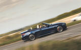 BMW M440i Cabriolet in blue   driving past, side profile BMW M440i Cabriolet in blue   driving past, side profile