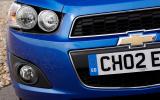 A large grille, split by Chevrolet’s ‘bow tie’ badge, evokes Aveo Mk1 Chevrolet Aveo headlights