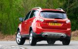 The fact it’s higher and heavier than a Focus is apparent at every turn Ford Kuga rear cornering