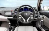 Attractive leather-rimmed, four-way adjustable wheel houses numerous controls Honda CR-Z dashboard