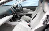 The seating position up front feels lower and more sporty than in the Insight Honda CR-Z interior