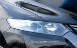 The projector-style headlamps are arranged in a four-light cluster, with the low-beam light unit having blue detailing Honda Insight headlight