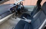 Low-slung seats make the Insight feel more like a conventional car than the Prius Honda Insight interior