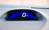 Background of digital speed readout changes colour depending on how you are driving: green for efficient, blue for lead foot.  Honda Insight speedometer