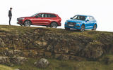 Audi and Volvo on ledge Audi and Volvo on ledge