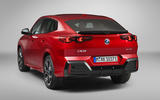 2024 BMW iX2 rear quarter studio 2024 BMW iX2 rear quarter studio
