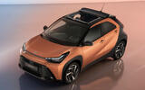 2026 Toyota Aygo X bronze front quarter static roof open 2026 Toyota Aygo X bronze front quarter static roof open