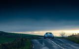 Cyan Volvo P1800 drive - on the road front Cyan Volvo P1800 drive - on the road front