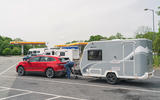 95 skoda enyaq iv 80 towing caravan unhitch side view