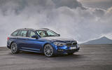 2017 BMW 5 Series Touring in front of mountains