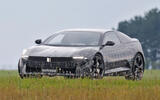 BMW Neue Klasse coupe camouflaged front quarter cornering