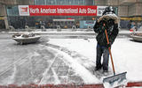 Detroit motor show - shovelling snow