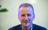 Volkswagen boss Herbert Diess talks to Autocar