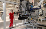 Ferrari E Building factory   worker inspects a screen