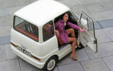 Women getting out of a Ford Comuta