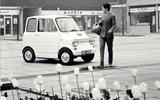 Woman next to a Ford Comuta