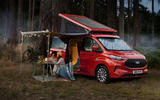 Ford Transit Custom Nugget with people sat outside  Ford Transit Custom Nugget with people sat outside