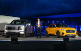 jim farley with ford f 150 lightning and ford mustang mach e