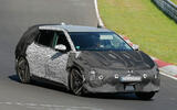 Kia EV4 hatch camo front quarter