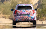 Mini Aceman camouflaged rear driving Mini Aceman camouflaged rear driving