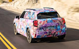 Mini Aceman camouflaged rear quarter driving Mini Aceman camouflaged rear quarter driving