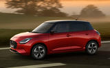 New Suzuki Swift red driving New Suzuki Swift red driving