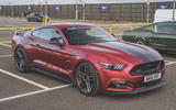 Parked dark red Ford Mustang