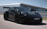 Porsche 911 gt3 2022 driving three quarters front