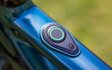 Sleek design is at the core of the Ribble Hybrid AL e's offering; this is the e-mode button