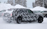 Rolls Royce SUV EV spy shot rear 3 4