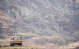 1978 two-door Range Rover before a mountain