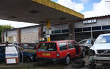 scrapped volvos under a petrol garage